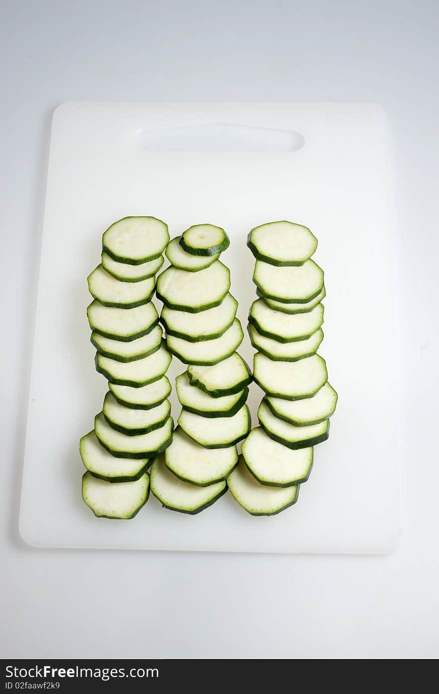 Cut Vegetable Marrow On Chopping Board