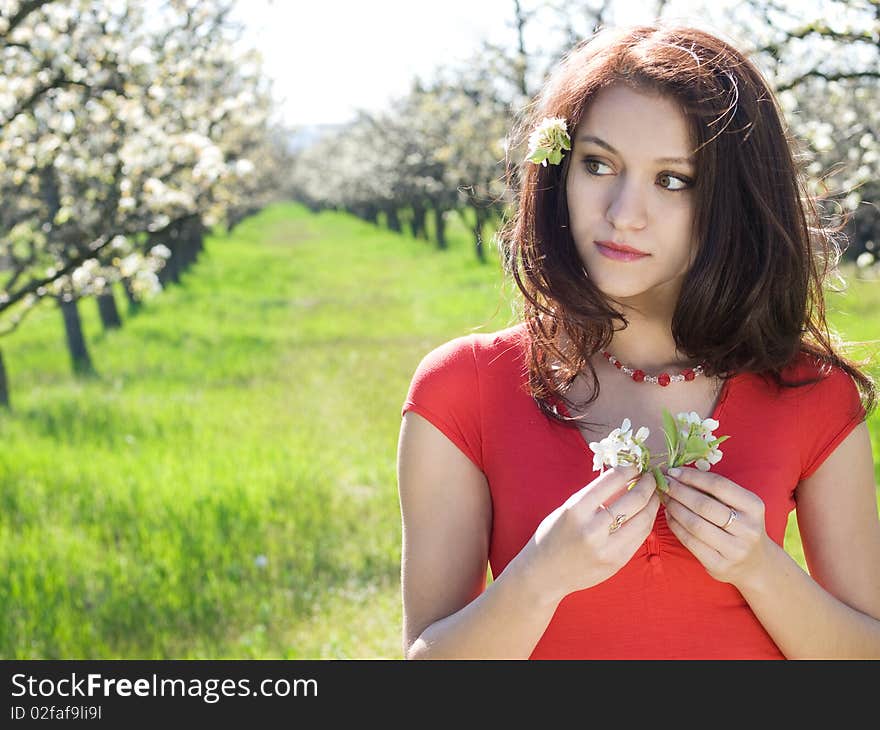 Beautiful young girl resting in spring garden. Beautiful young girl resting in spring garden