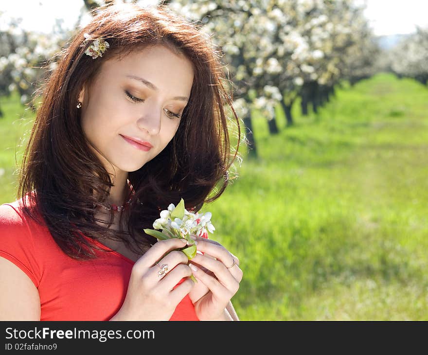 Beautiful young girl resting in spring garden. Beautiful young girl resting in spring garden