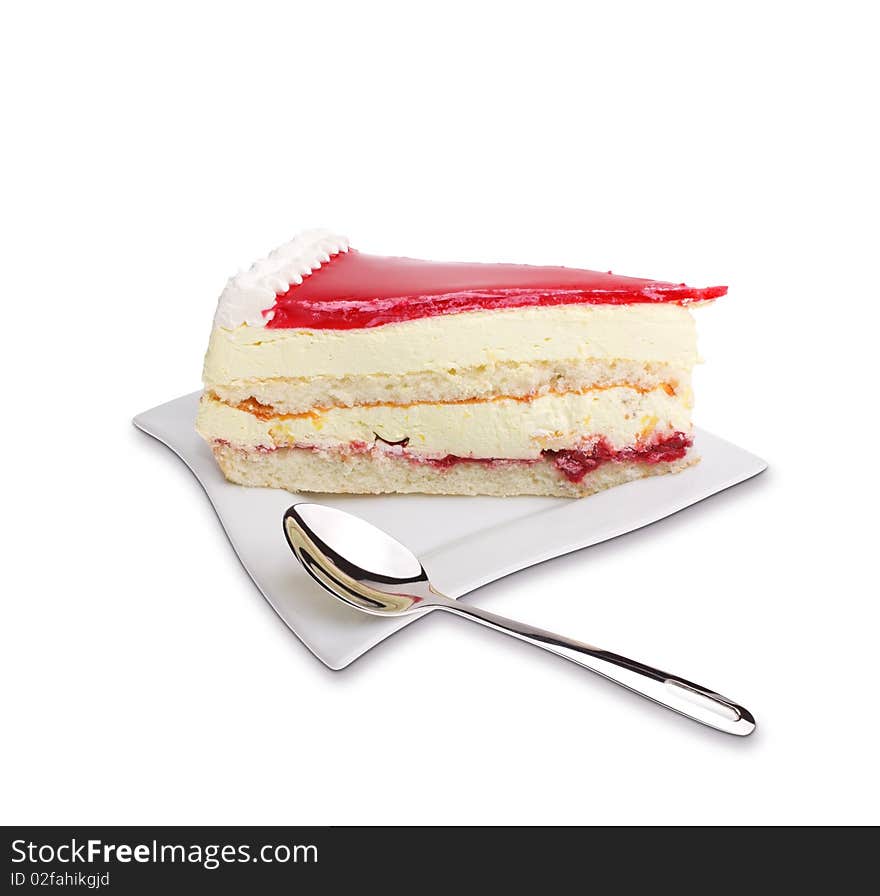 Dessert - cake with red fruit jelly on white plate