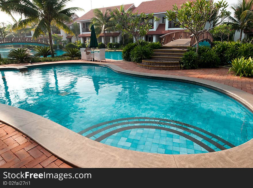 A beautiful large swimming pool at a local resort