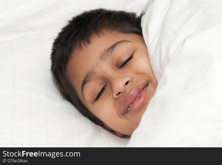 A handsome indian kid smiling for you