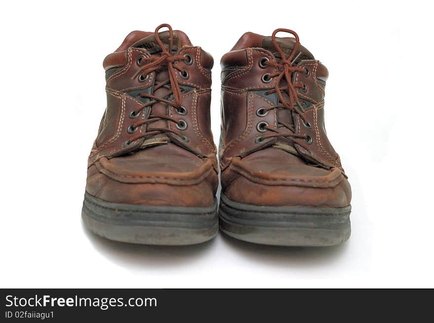 A beautiful pair of brown shoes isolated on white background