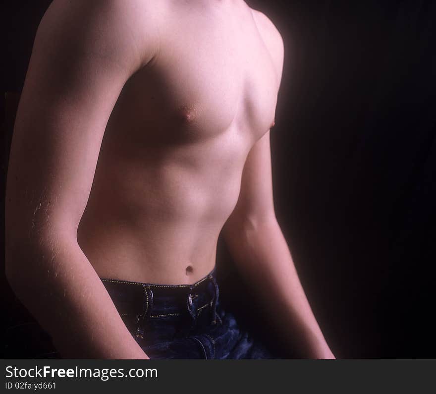 A studio shot of a body part of a young teen