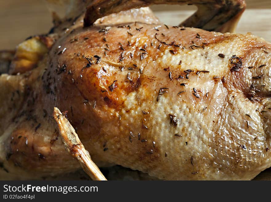 Roasted duck on wooden table