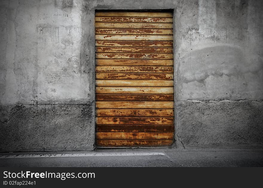 Old rusty entrance door of a shop