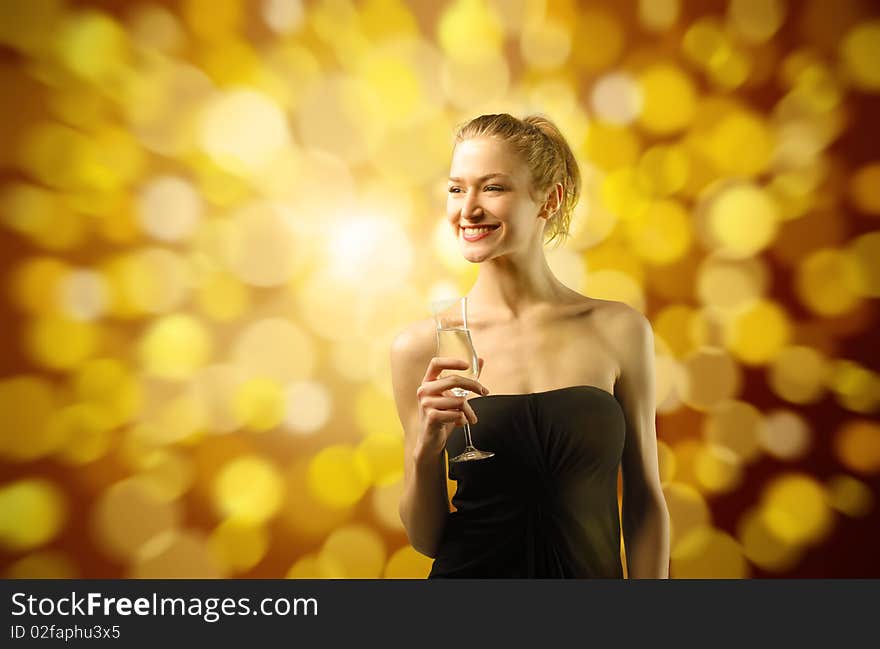 Beautiful and elegant woman holding a glass of wine with fuzzy background. Beautiful and elegant woman holding a glass of wine with fuzzy background