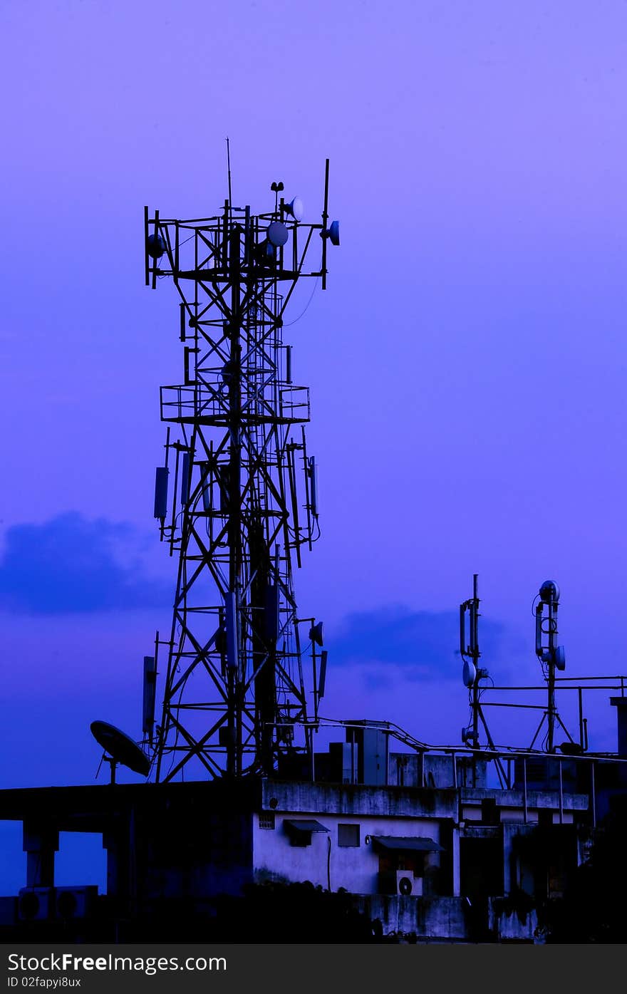 A communication tower on a moody evening