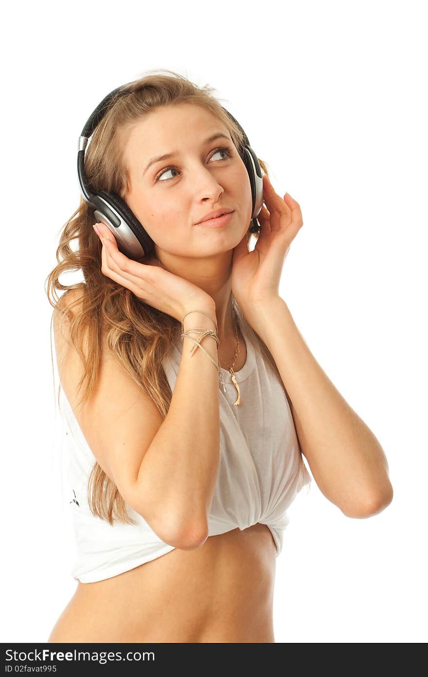 The young beautiful girl with headphones isolated on a white background