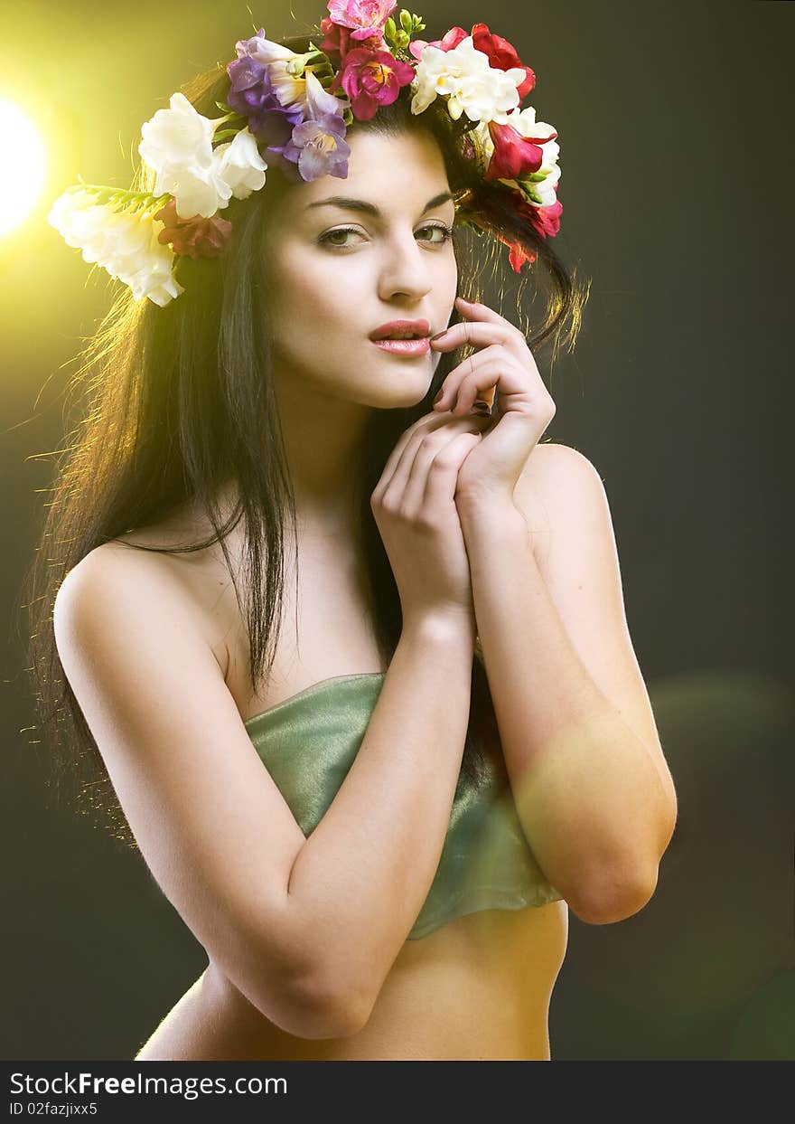 Studio portrait of a beautiful with flower crown. Studio portrait of a beautiful with flower crown