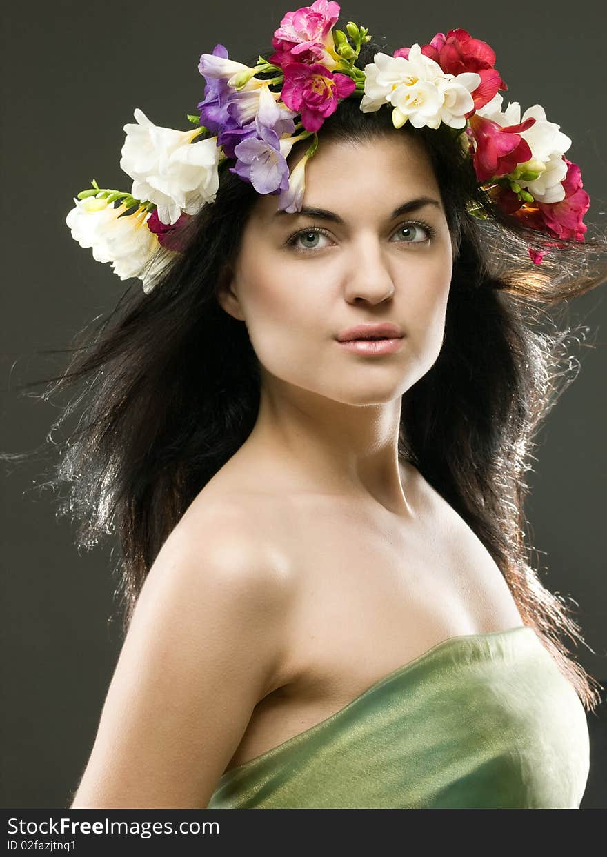 Studio portrait of a beautiful with flower crown. Studio portrait of a beautiful with flower crown