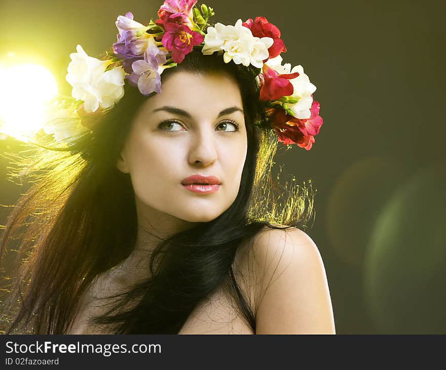 Studio portrait of a beautiful with flower crown. Studio portrait of a beautiful with flower crown