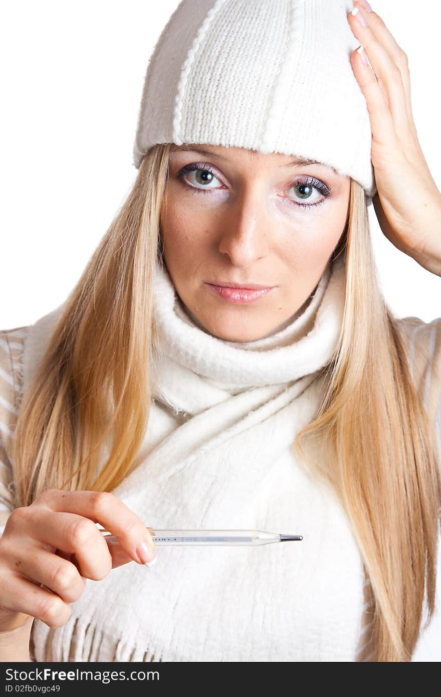 Caucasian blonde woman holding thermometer with white hat and scarf. Caucasian blonde woman holding thermometer with white hat and scarf