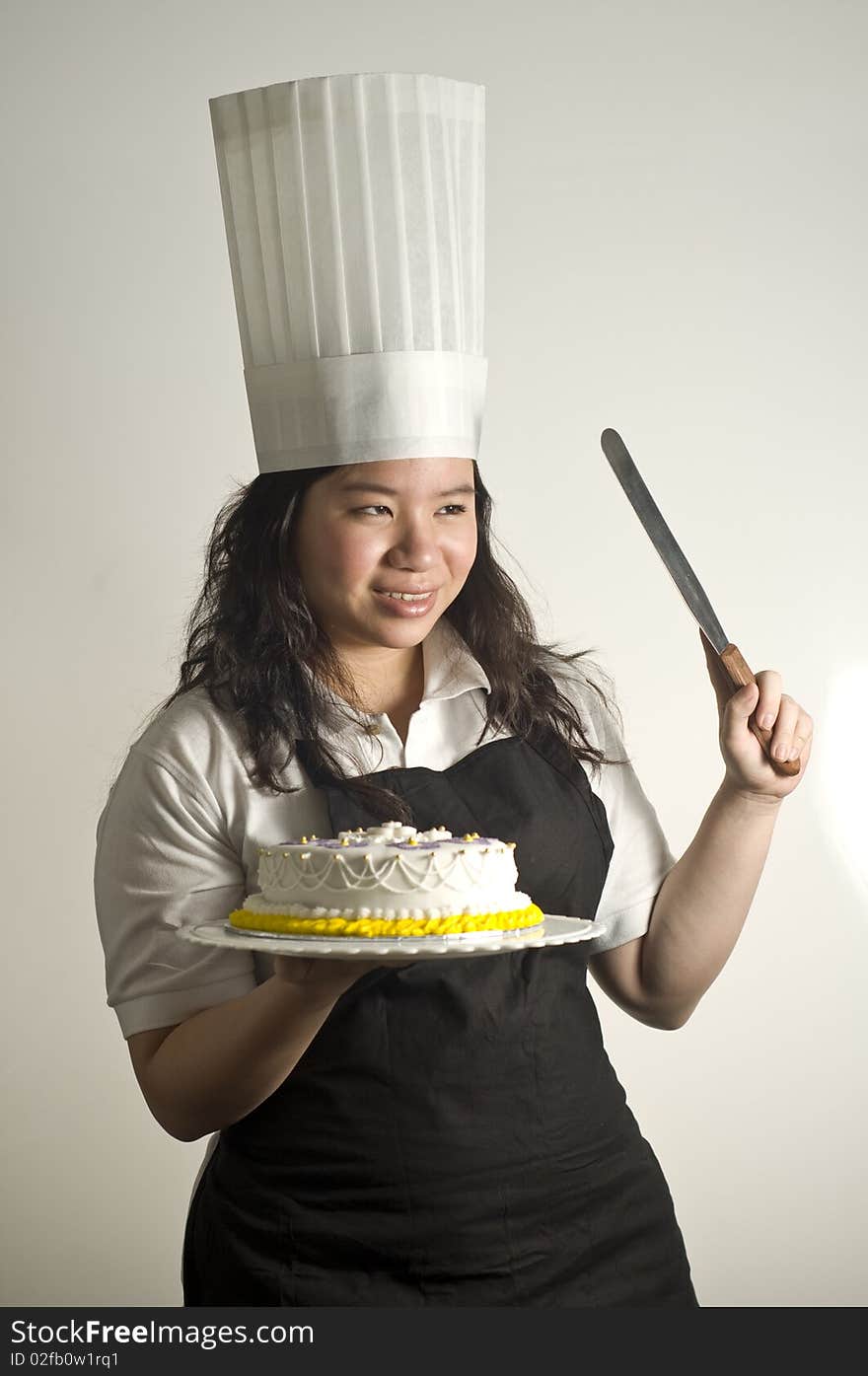 Baker presenting a (birthday cake) to the viewer. Useful for parties and celebrations. Baker presenting a (birthday cake) to the viewer. Useful for parties and celebrations.