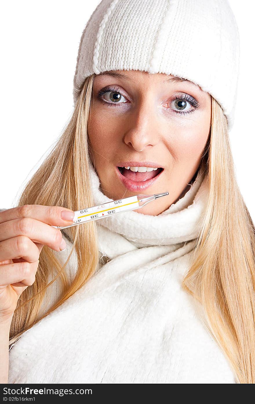 Caucasian blonde woman holding thermometer with white hat and scarf. Caucasian blonde woman holding thermometer with white hat and scarf