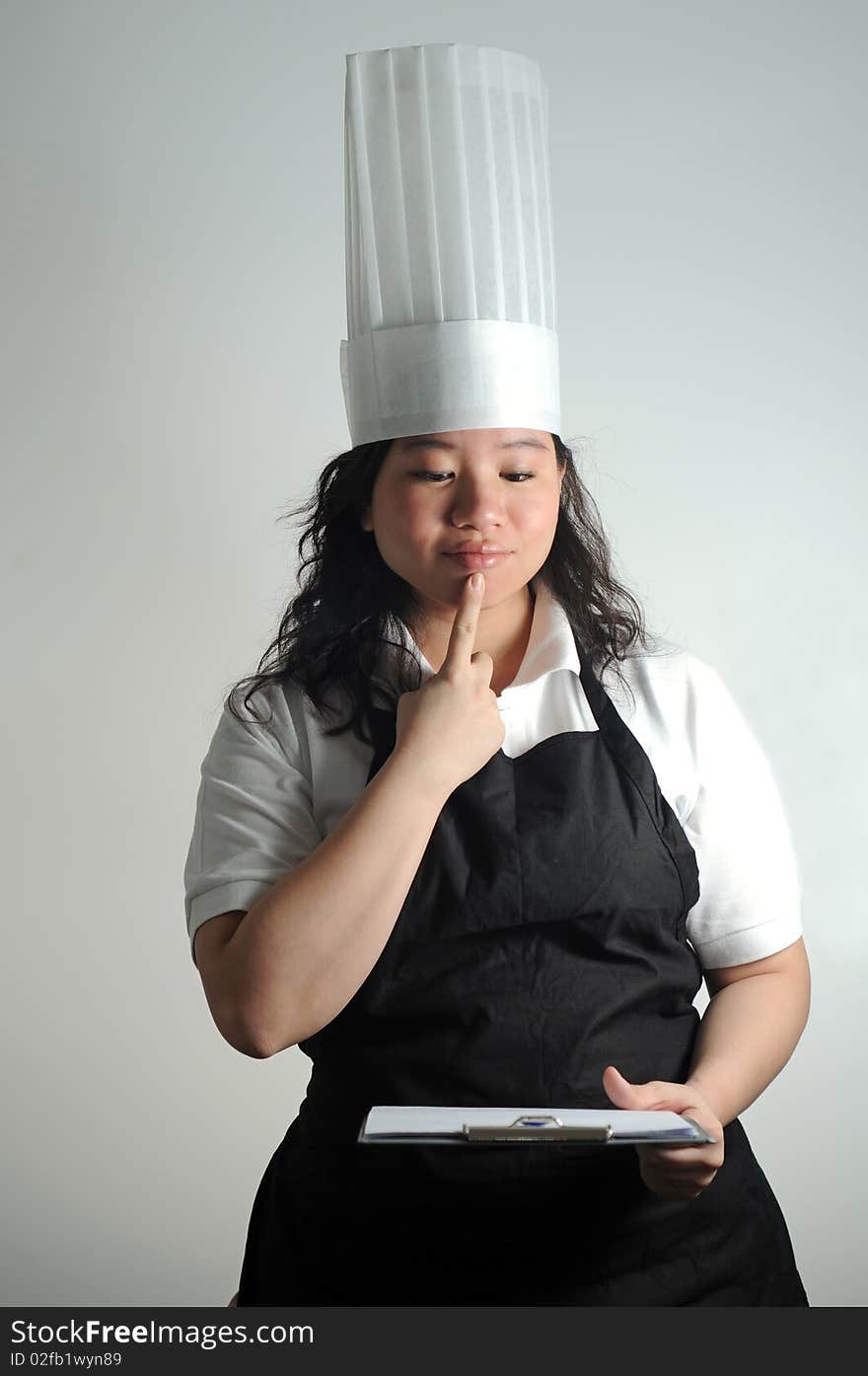 Chef Pondering Over Cooking Checklist