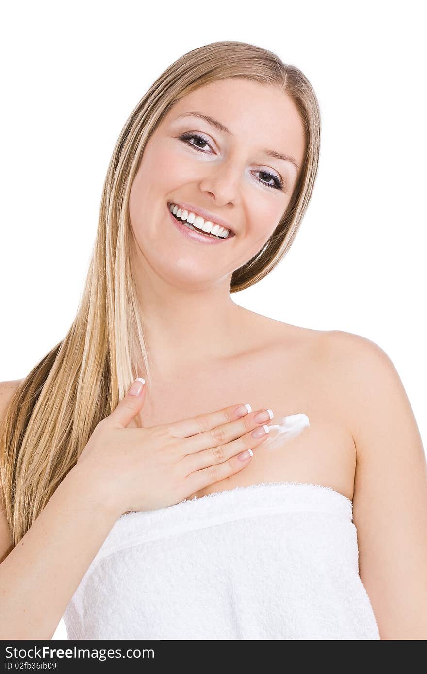 Caucasian blonde woman creaming chest