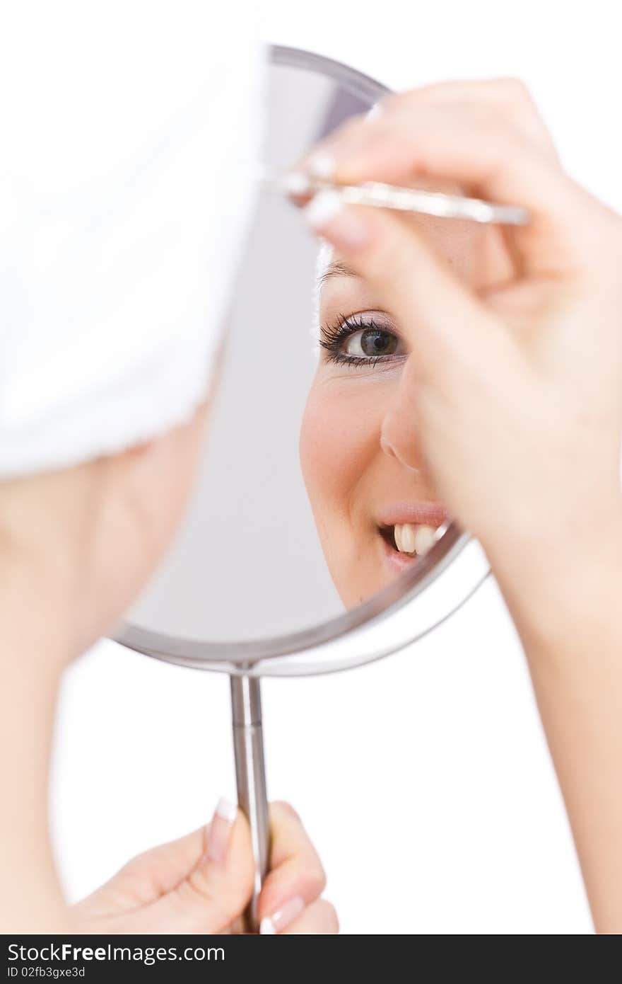 Woman makeup in mirror reflection on isolated background