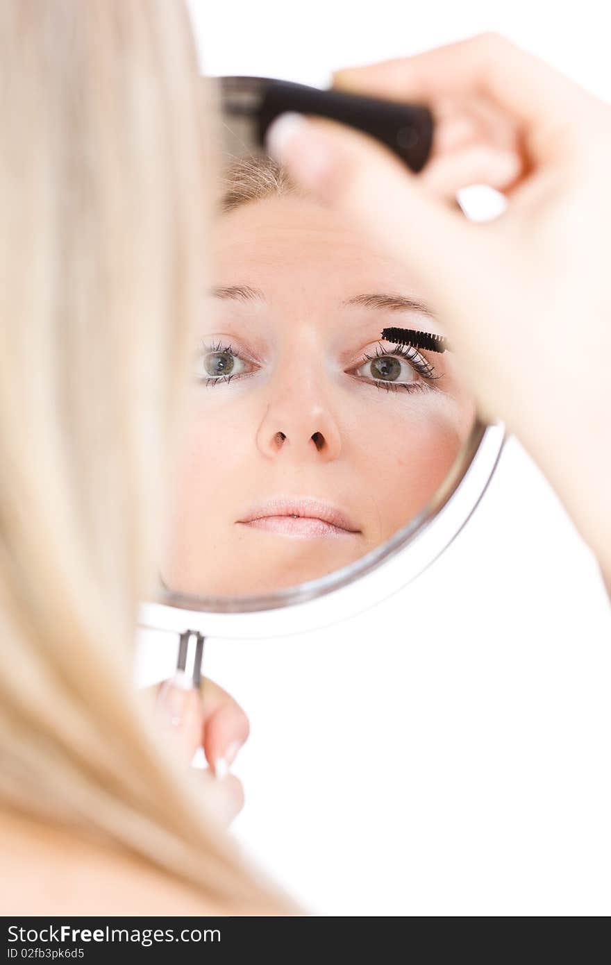 Woman makeup in mirror reflection on isolated background