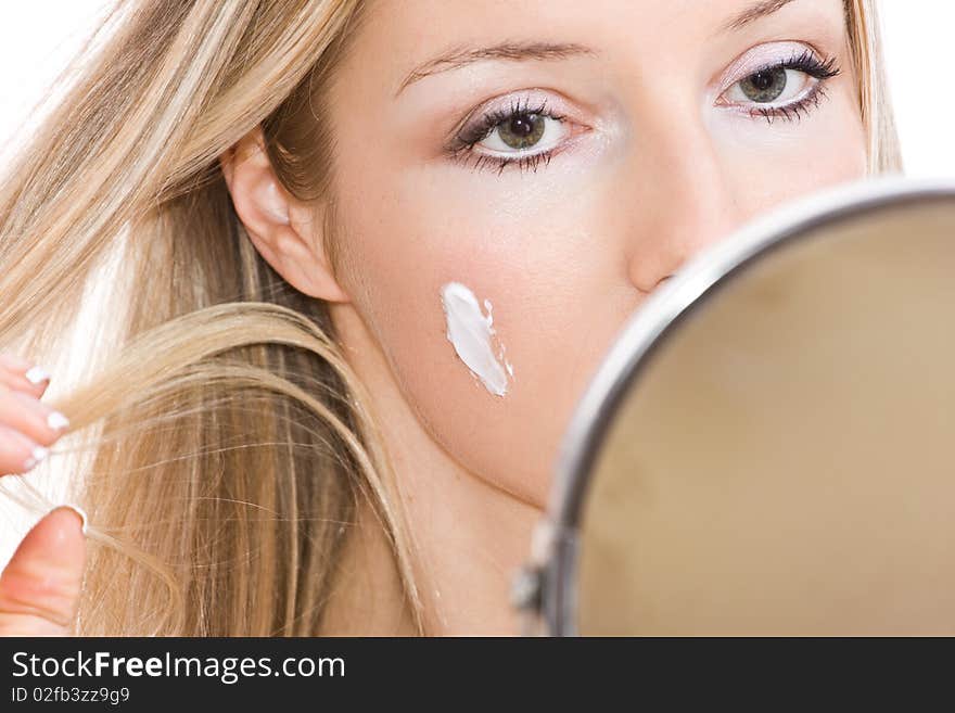 Woman makeup in mirror reflection on isolated background