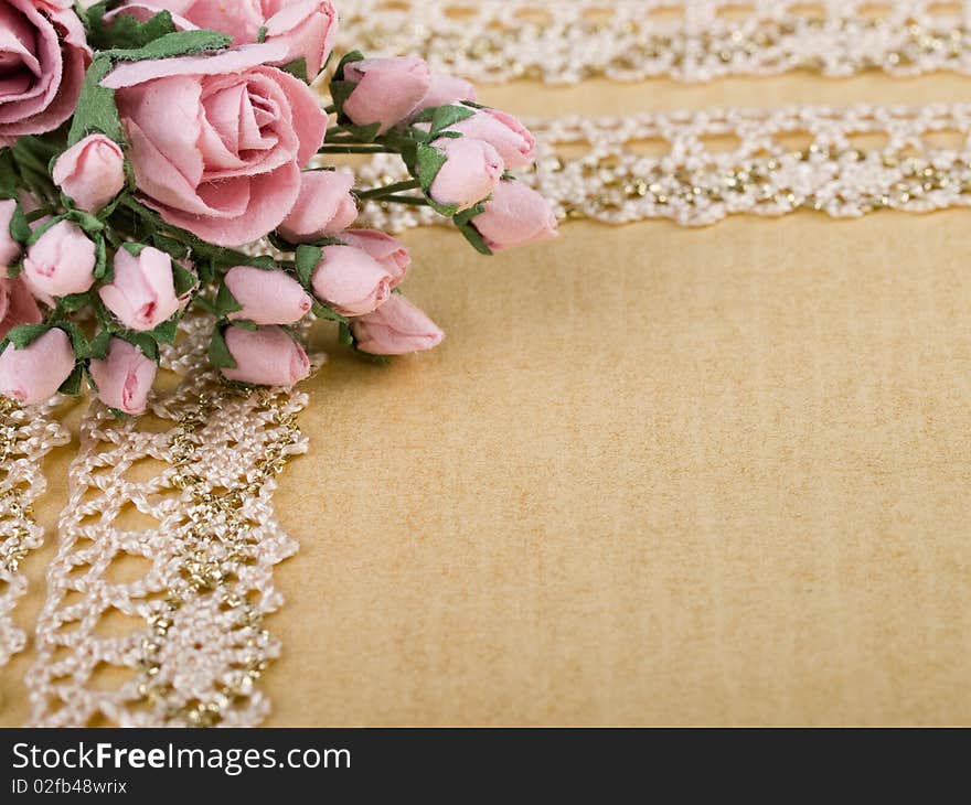 Closeup shot of pink paper flowers on beige background