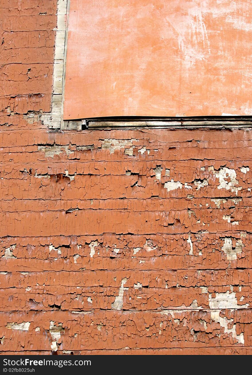 Grunge scratched texture / background on a cracked wooden wall with cardboard at the top. Grunge scratched texture / background on a cracked wooden wall with cardboard at the top.