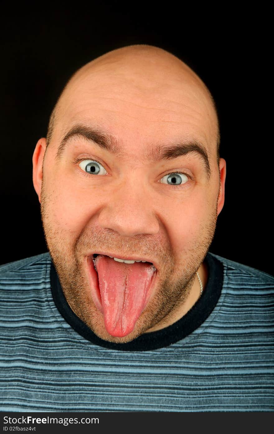 Happy man portrait on a black background