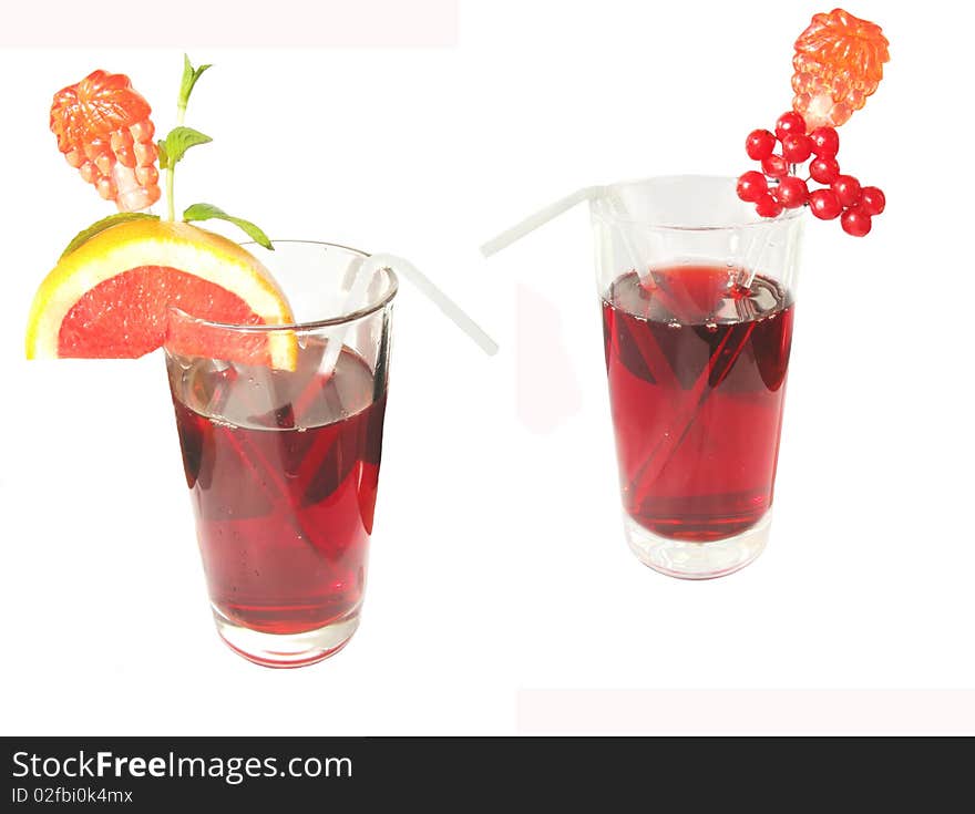 Two fruit juices with mint orange and red currant isolated. Two fruit juices with mint orange and red currant isolated