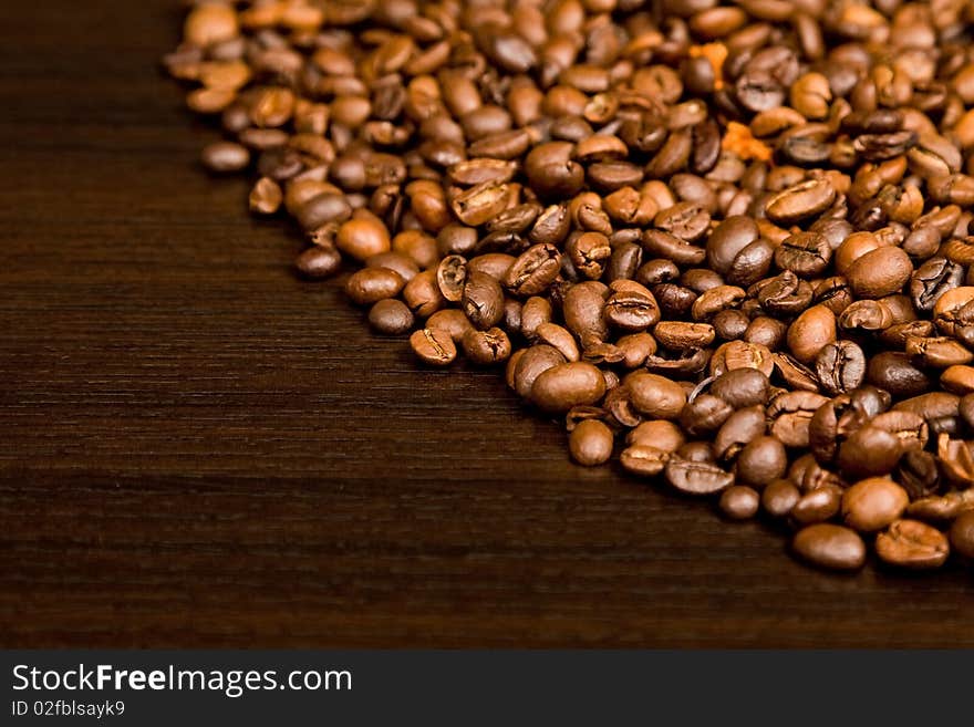 Background with coffee beans and ground coffe