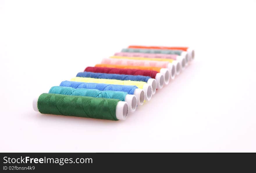 Colored spools of thread to sew