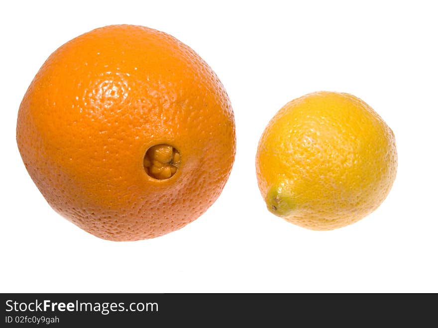 One orange and one lemon on an isolated background. One orange and one lemon on an isolated background.