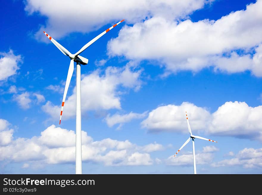 Windmill conceptual image. Windmills against the blue sky.