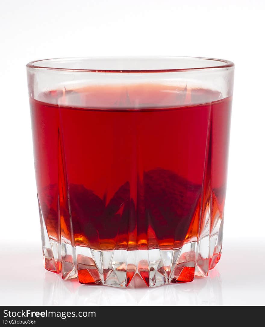 Glass of strawberry stewed fruit isolated on white