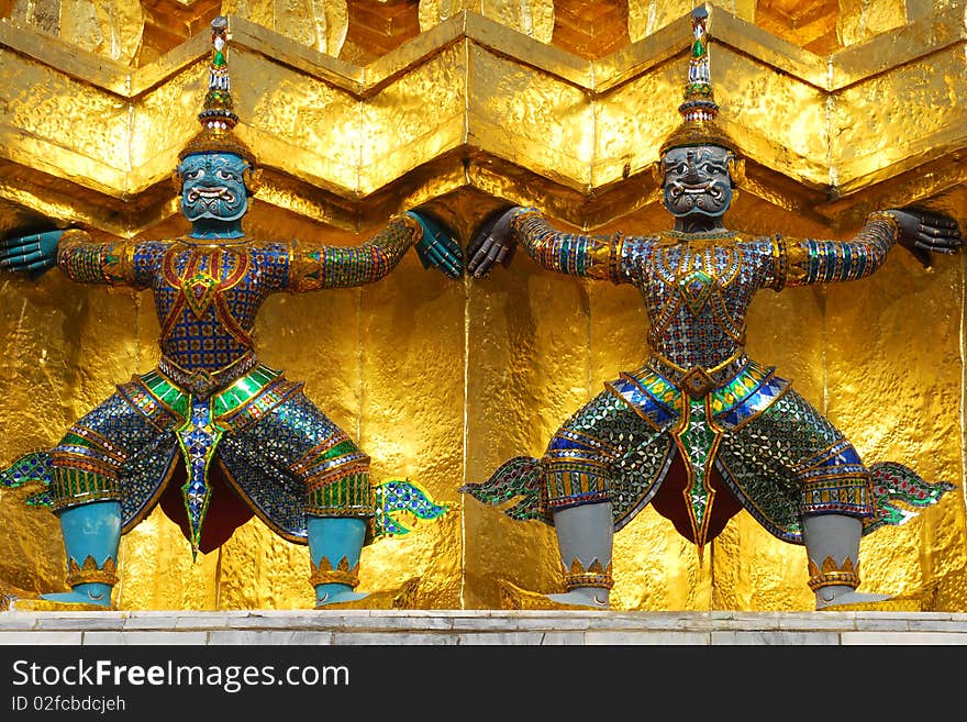 Two giants statue at gold pagoda in Palace Bangkok Thailand. Two giants statue at gold pagoda in Palace Bangkok Thailand.