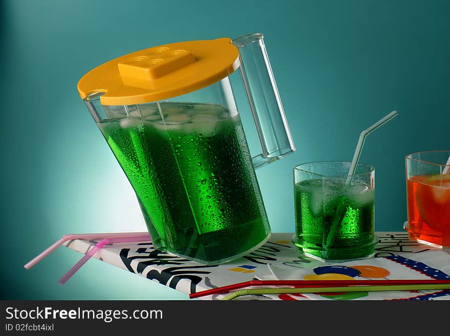 Jar and glasses with colourful drinks