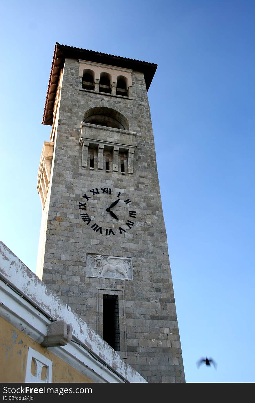 Church tower in main square in capital of Rhodes in Greece