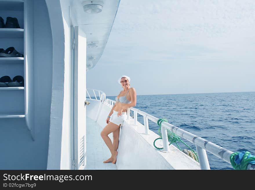 A young woman travel on the yacht