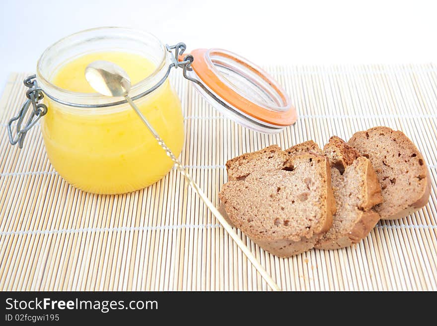 Brown sliced homemade bread with yellow cream. Brown sliced homemade bread with yellow cream