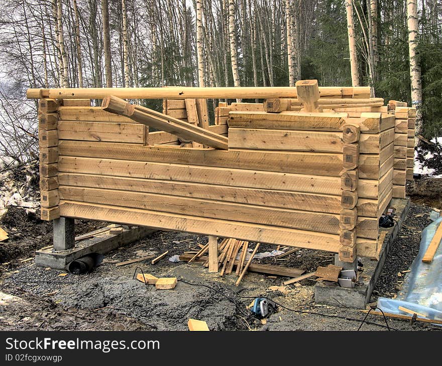 Log cabin under construction on site