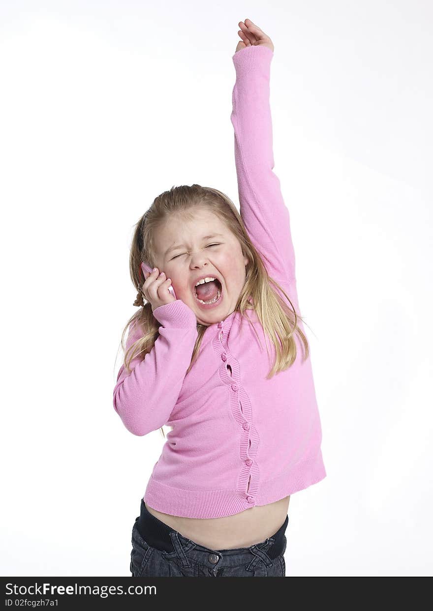 Little girl having fun with a mobile phone. Little girl having fun with a mobile phone