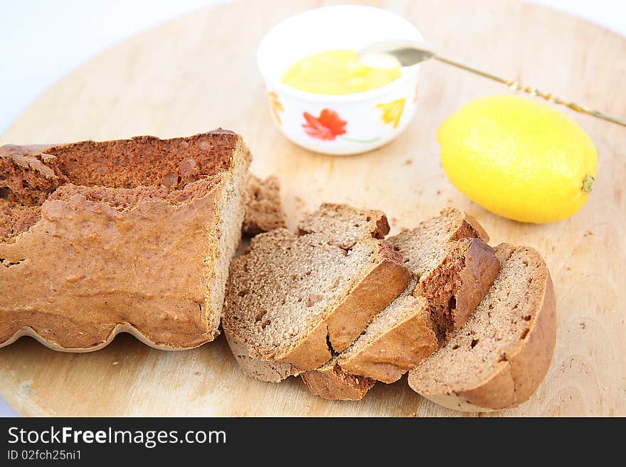 Breakfast with brown fresh bread with lime