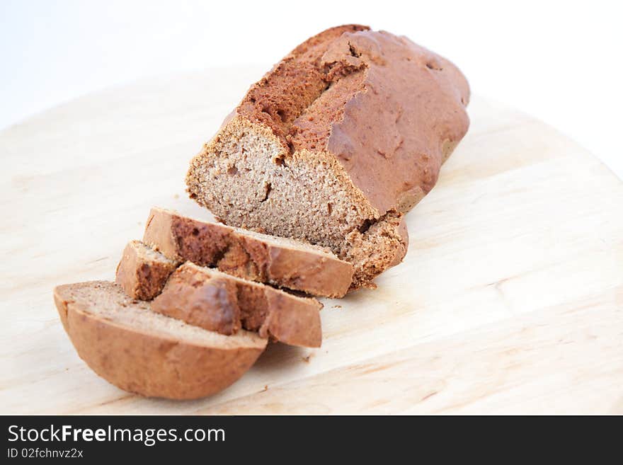 Brown sliced fresh bread on wooden desk