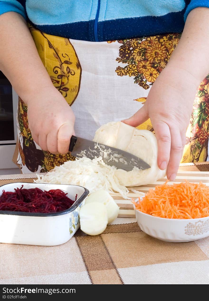 Hands Cutting Vegetables on plate for cooking