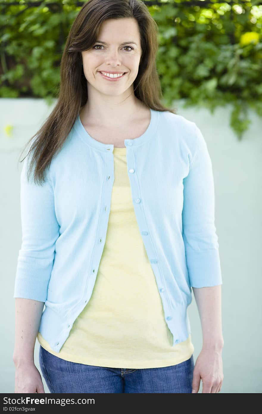 Portrait of A Happy Young Woman Smiling To Camera