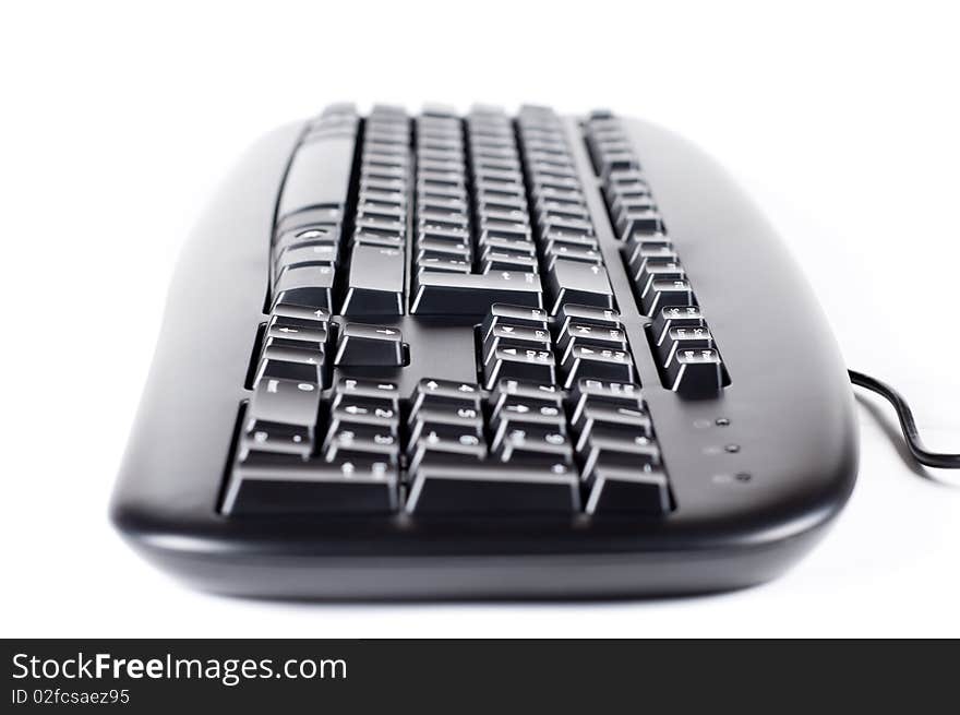 The keyboard isolated on a white background close up. The keyboard isolated on a white background close up.