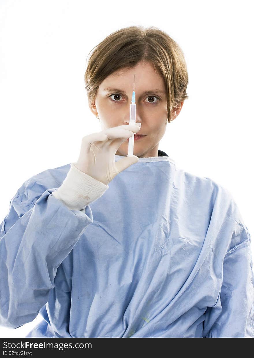 Young female doctor holding a syringe in her hand