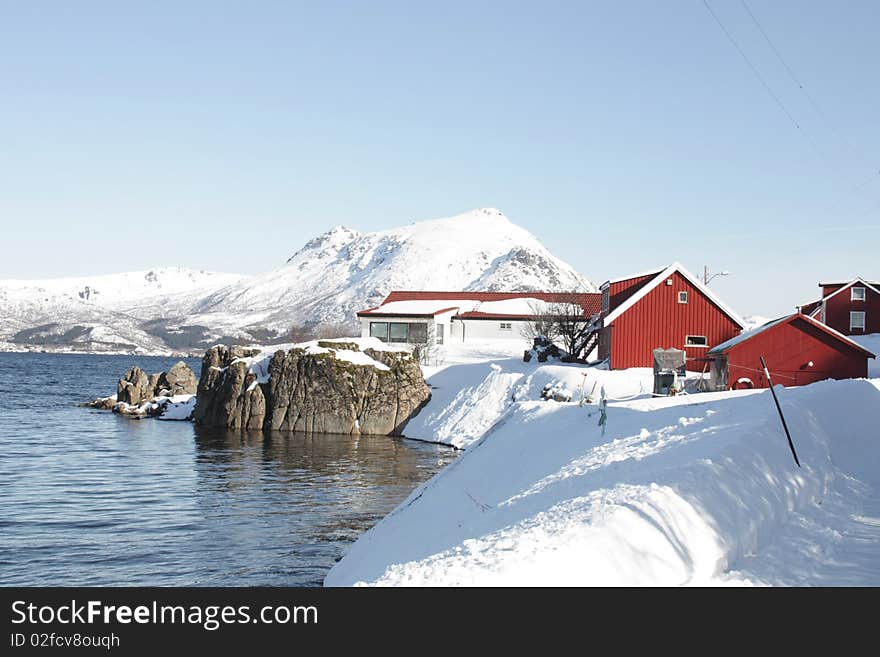 A lofoten's village mirroring in Busknes fjord. A lofoten's village mirroring in Busknes fjord