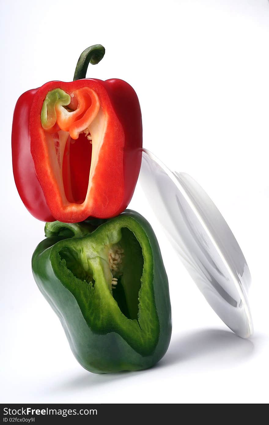 Red and green bell pepper on white. Red and green bell pepper on white