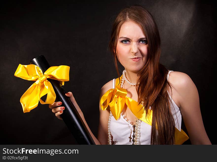 The girl in a white dress with a bat. The girl in a white dress with a bat