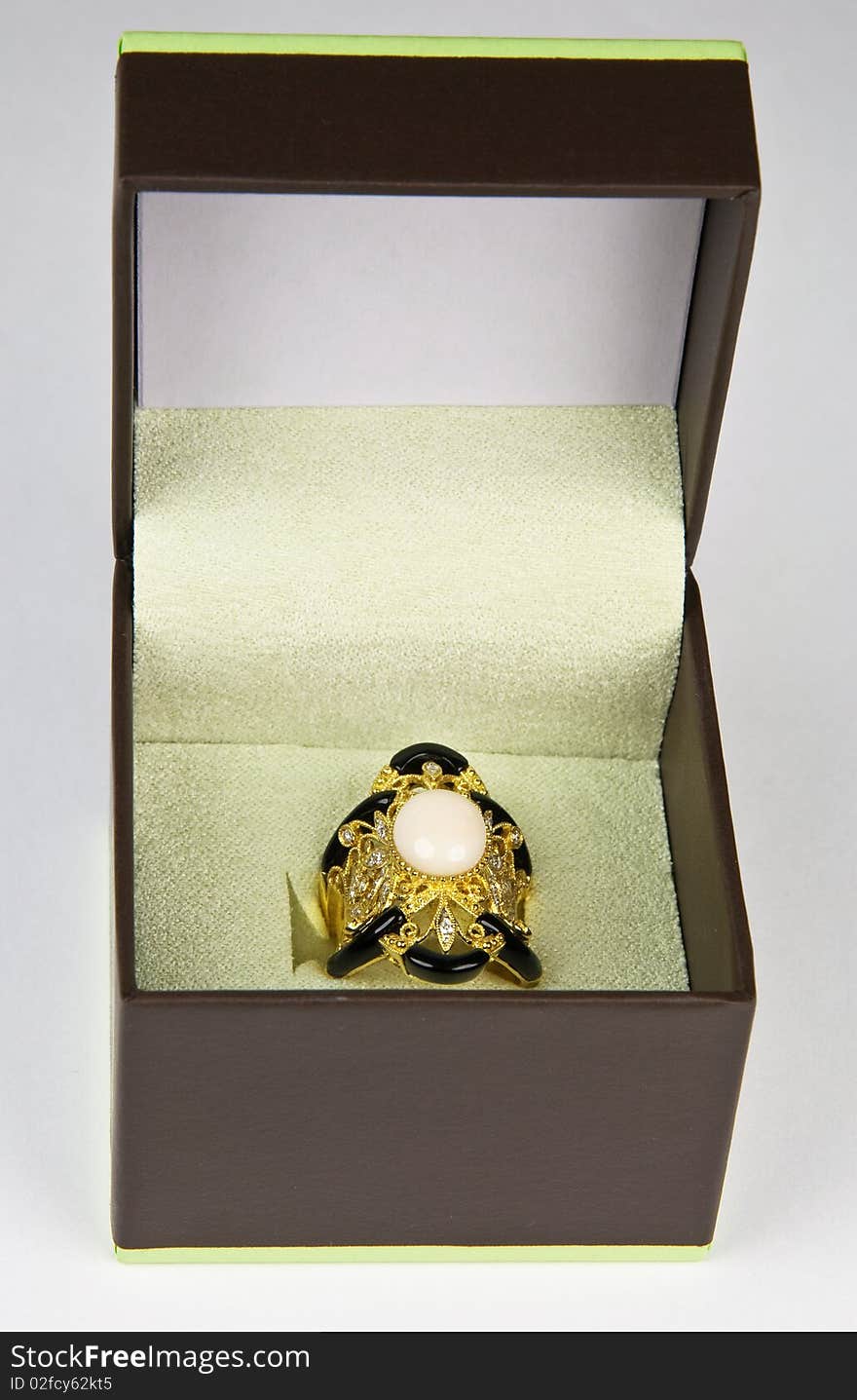 Coral statement ring with carved black onyx and diamonds in presentation box box